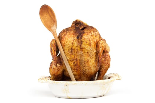 Grilled chicken with wooden spoon,eating in front of white background