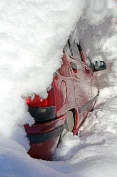 The snow-covered car