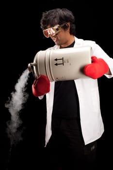 Indian scientist pouring from a dewar of liquid nitrogen