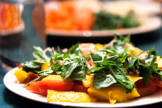 Green salad served with mango and tomatoes