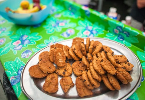Cookies on a silver platter at a picnic