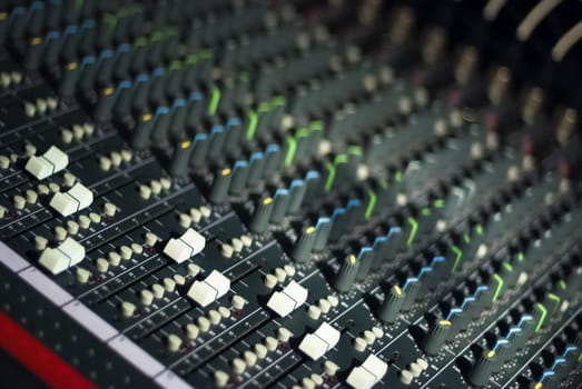 Audio mixing board in a dark room