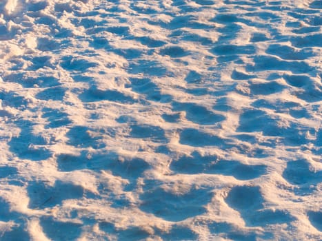 Footprints worn into the snow on a winter day