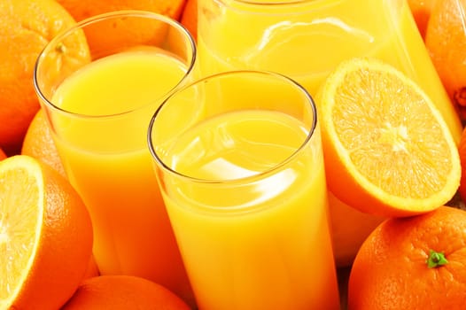 Composition with two glasses of orange juice and fruits