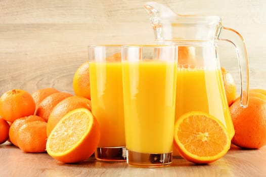 Composition with two glasses of orange juice and fruits