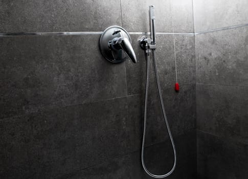 Shower handle and head in the darkness