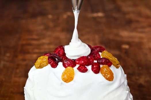 Christmas creamy cake decoration with pastry bag