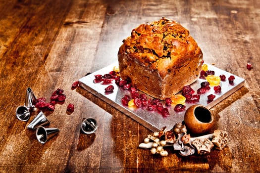 Christmas cake with red berries metal tips and xmas decorations
