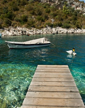 footbridge over the sea with white ship
