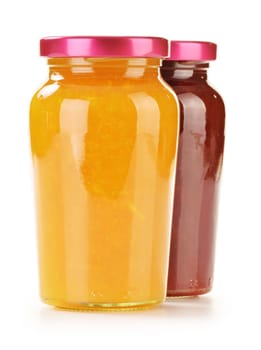 Two jars of fruity jams isolated on white background. Preserved fruits