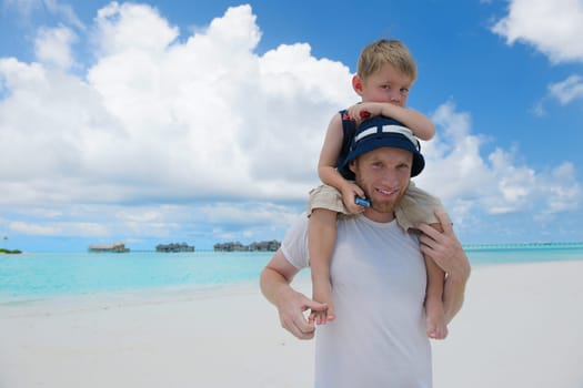 Portrait of a happy family on summer vacation  at beach