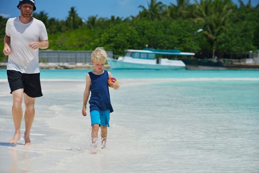 Portrait of a happy family on summer vacation  at beach