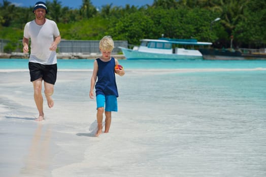 Portrait of a happy family on summer vacation  at beach