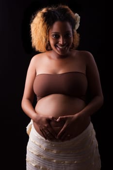 Young beautiful pregnant african woman , black white background