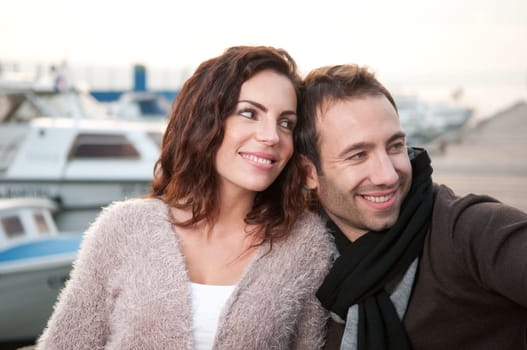 Relaxed couple on wooden pier