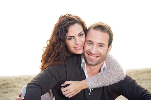 Beautiful happy young couple at the beach