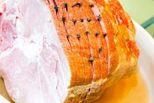 Spiral Cut Glazed Bone-in Ham with Cloves Macro Closeup