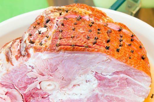 Spiral Cut Glazed Bone-in Ham with Cloves Closeup