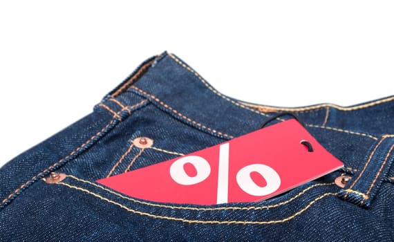 Red Sale Tag With Percentage Symbol in Pocket of Blue Jeans