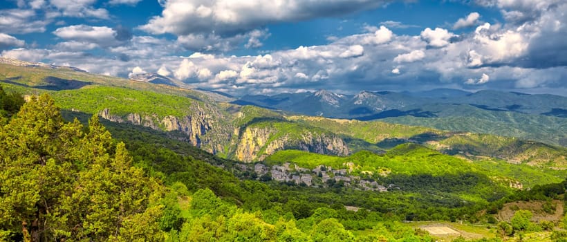 Panoramic view of Monodendrei village, Vikos gorge and Pindos Mountains, Greece.