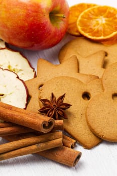 fresh apple with biscuit,cinnamon and fruit dried on white background