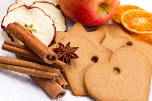 fresh apple with biscuit,cinnamon and fruit dried on white background