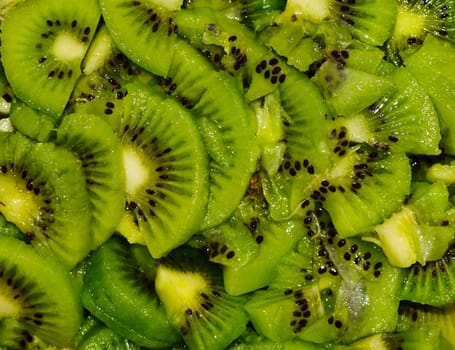 Healthy food background with green kiwi fruits slices