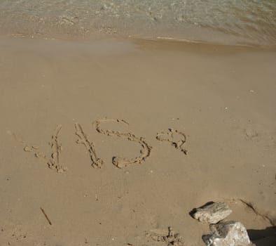 Vis word in the sand at the beach