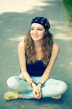 Portrait of a beautiful 20 year old woman enjoying a summer day outdoor.