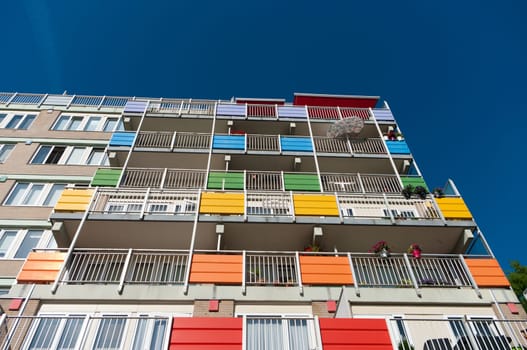 exterior of a modern retirement apartment building with colorful balconies