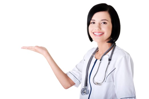 Young medical doctor woman presenting and showing copy space for product or text.