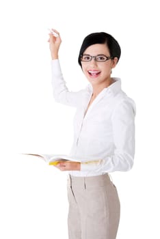 Teacher with book and chalk in hands presenting something on abstract chalkboard. Isolated on white