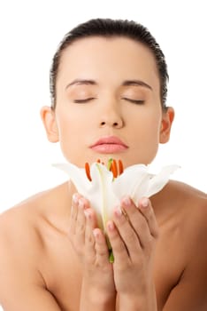 Portrait of beautiful young woman with health skin and with lily flower