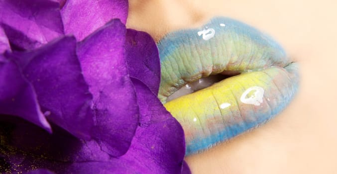 Woman's lips with flower