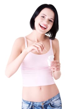 Beautiful young woman using dental floss