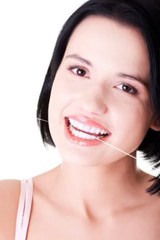 Beautiful young woman using dental floss