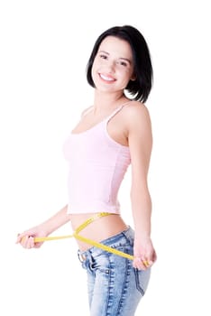 Happy young woman measuring her waist