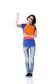 Happy student woman with notebooks showing win gesture with fist, isoalted on white background