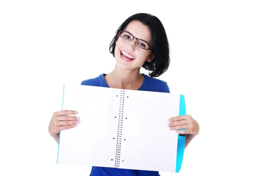 Studying happy young woman showing blank pages of her notebook for school.