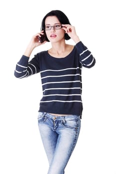 Young caucasian woman is calling with a mobile phone isolated on white