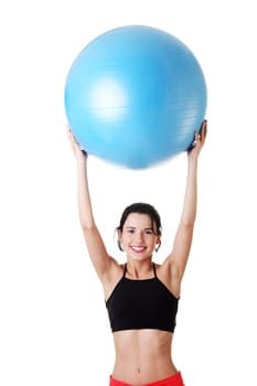 Beautiful young healthy lifestyle woman with pilates exercise ball.