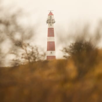 Red and white lighthouse on the dutch isle of Ameland, Holland