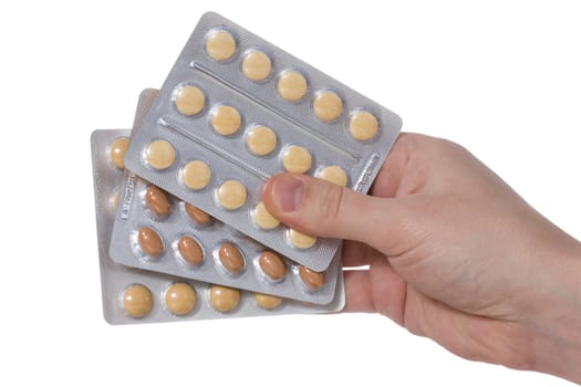 Medical pills containers in a  hand, isolated on white background