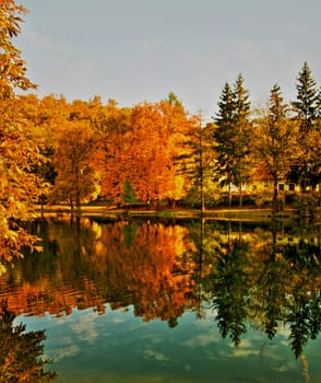 Beautiful colors of autumn landscape by the lake
