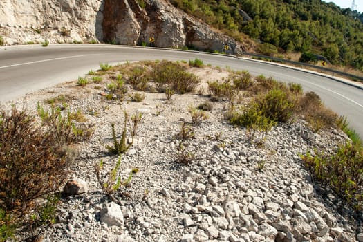 winding road in deserted landscape in vis island