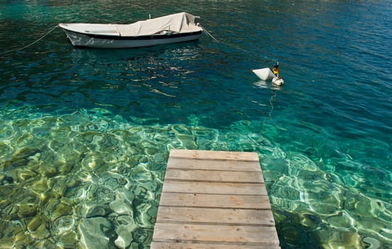 footbridge over the sea with white ship