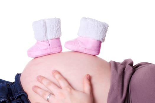 Baby shoes on baby bump