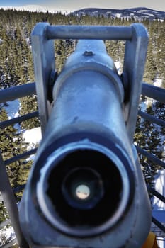 The highest mountain of the Czech Republic Snezka in telescope. Shot from the tower Black Mountain (Cerna hora).