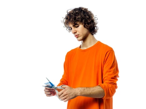 one young man caucasian happy holding credit card portrait  in studio white background