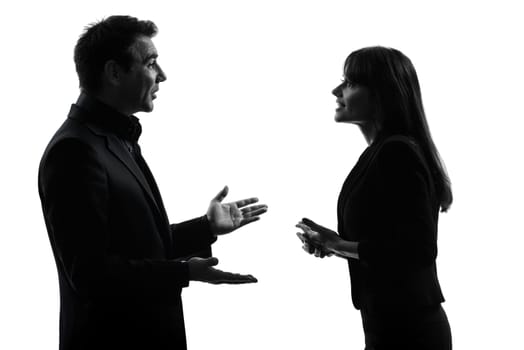 one caucasian couple business woman man in silhouette studio isolated on white background